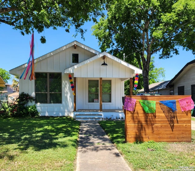 view of front of house featuring a front yard and a porch