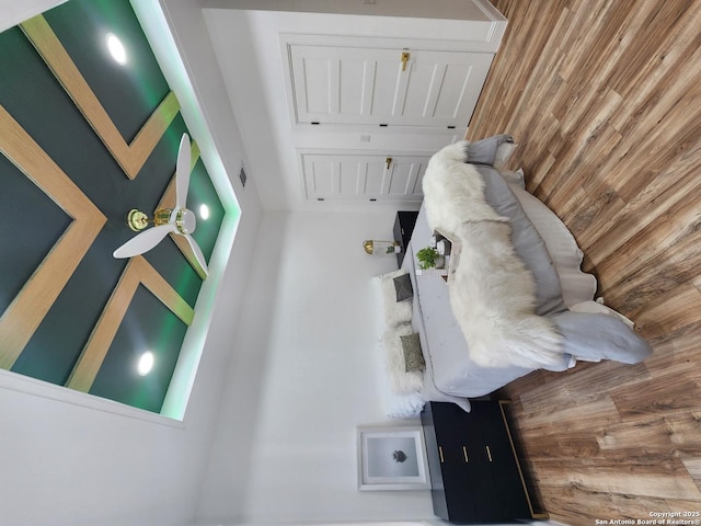 unfurnished living room with wood walls