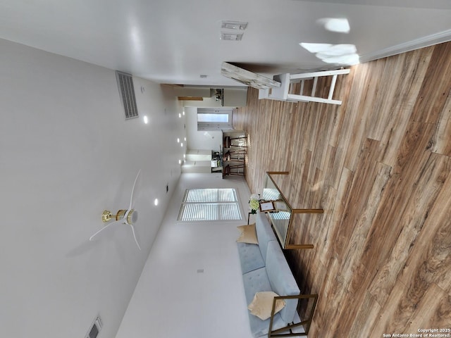 hallway with wood walls