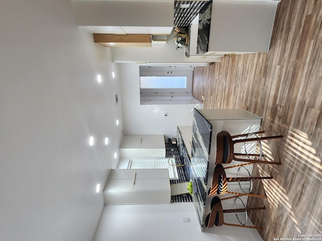 kitchen featuring wooden walls