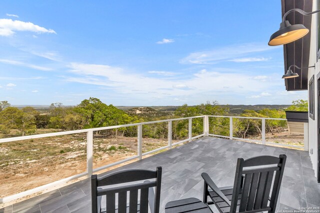 view of patio with a balcony