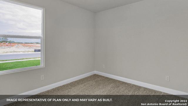 empty room with carpet flooring