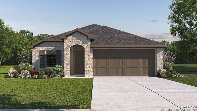 view of front of home featuring a yard and a garage