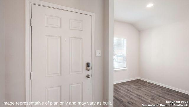 interior space with dark hardwood / wood-style floors and vaulted ceiling