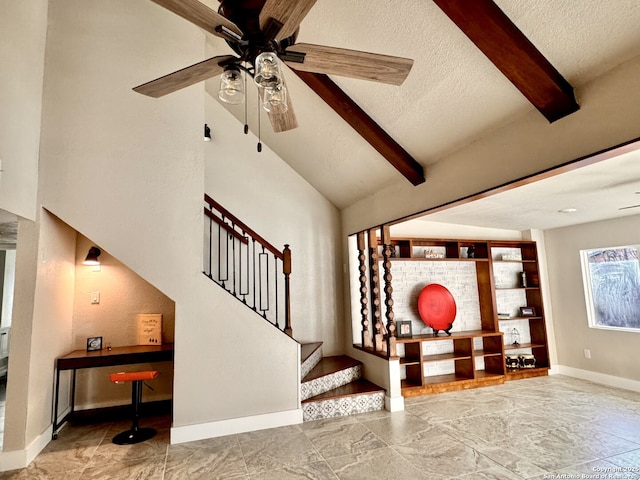 stairway with vaulted ceiling with beams, ceiling fan, and a textured ceiling