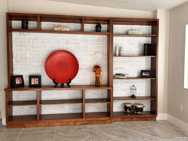 mudroom with light tile patterned flooring and lofted ceiling