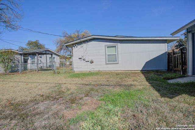 view of property exterior with a yard