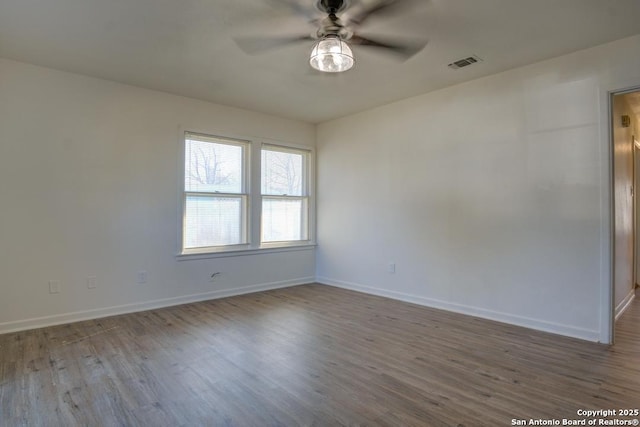 unfurnished room featuring hardwood / wood-style floors and ceiling fan