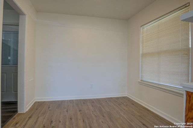 unfurnished room featuring light hardwood / wood-style flooring