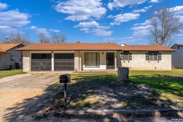 single story home featuring a front yard, a garage, and central AC unit