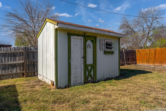 view of outdoor structure with a lawn