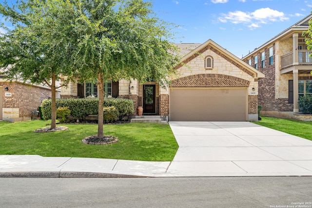 view of front of home featuring a front lawn and a garage