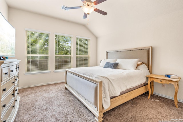 bedroom with ceiling fan, light carpet, and vaulted ceiling