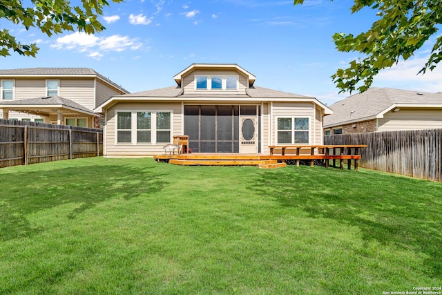 back of house featuring a yard