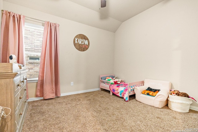 carpeted bedroom featuring ceiling fan and lofted ceiling