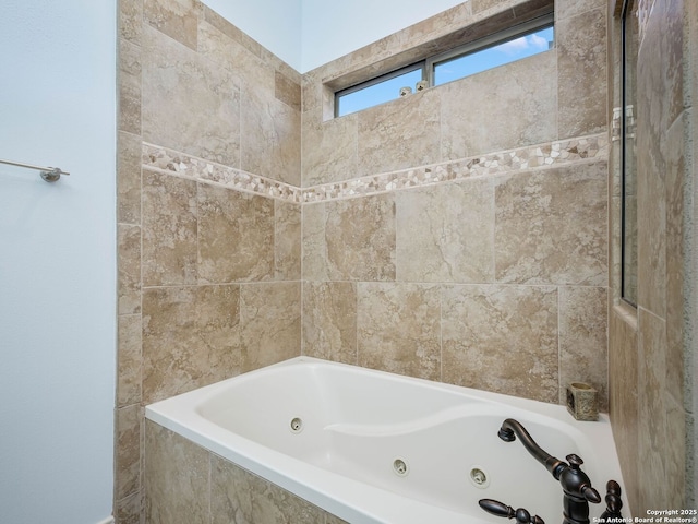 bathroom with tiled bath