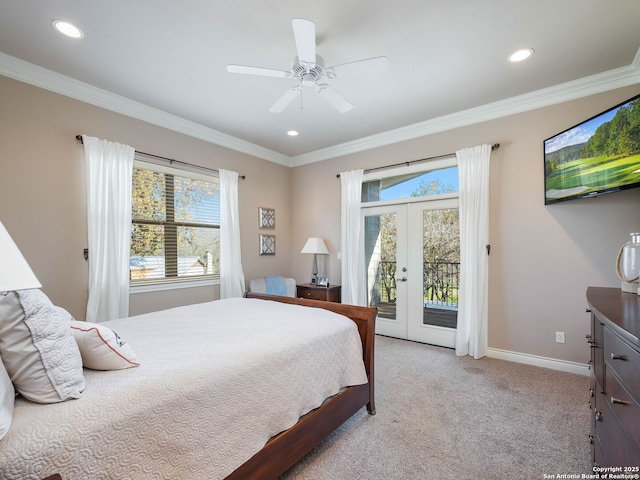 carpeted bedroom with access to exterior, french doors, multiple windows, and ceiling fan