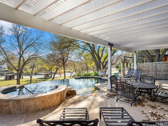 view of patio / terrace with a pergola and a fenced in pool