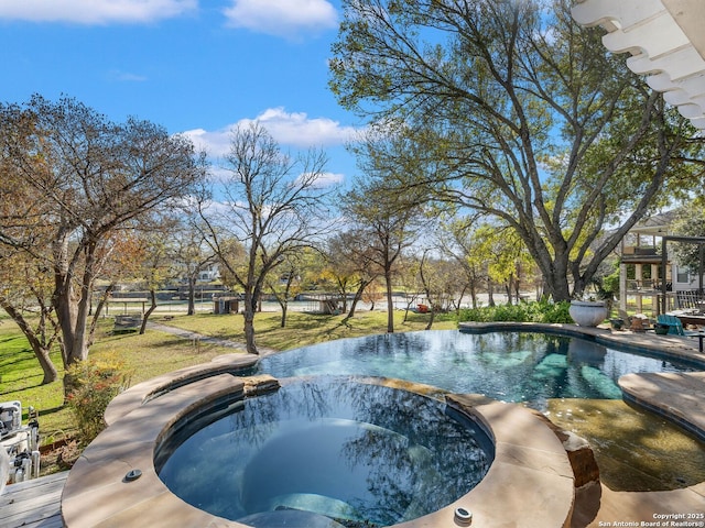 view of swimming pool featuring an in ground hot tub and a lawn