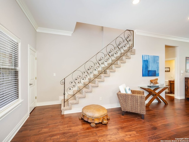 entrance foyer featuring crown molding and dark wood-type flooring