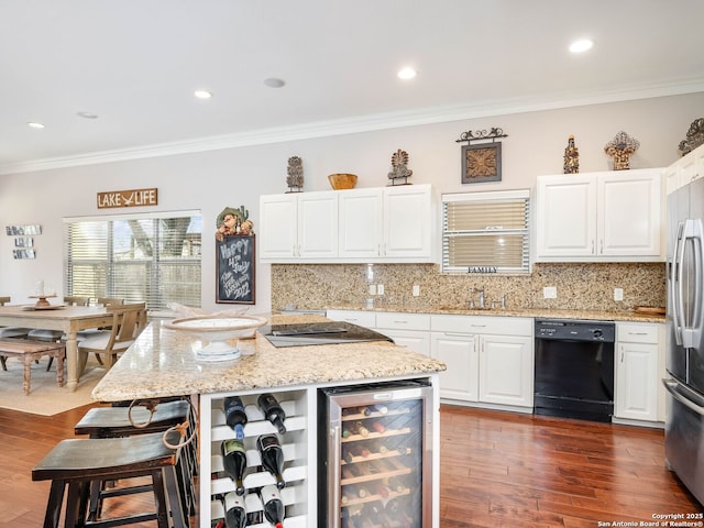 kitchen featuring light stone countertops, beverage cooler, crown molding, black appliances, and white cabinets