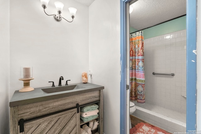 111 Austin Dr S, Boerne, TX 78006 - bathroom featuring tiled shower, vanity, a textured ceiling, and toilet