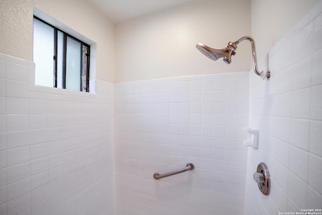 bathroom with a tile shower