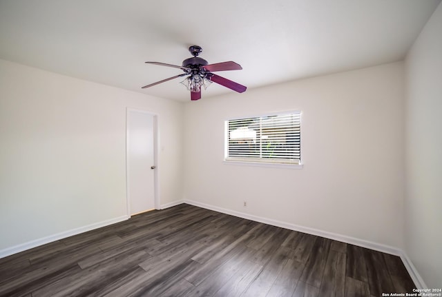 empty room with ceiling fan and dark wood-type flooring