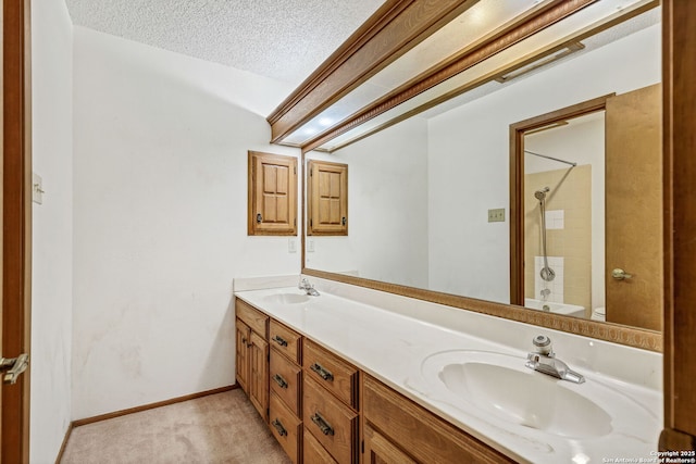 full bathroom with shower / bathing tub combination, vanity, toilet, and a textured ceiling