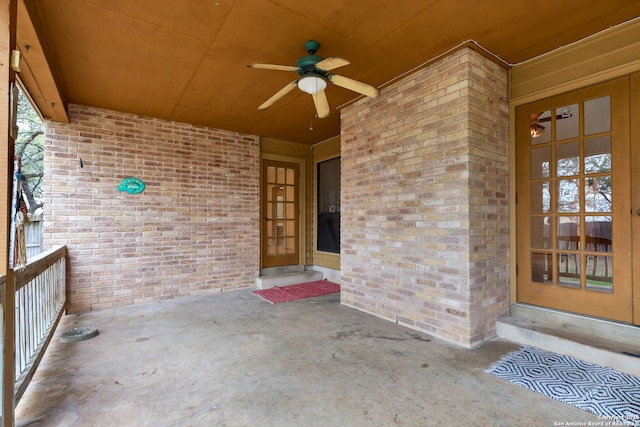 entrance to property featuring ceiling fan