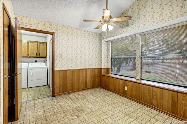 interior space with washer and dryer and ceiling fan