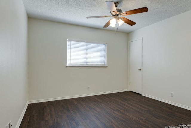 unfurnished room with a textured ceiling, dark hardwood / wood-style floors, and ceiling fan