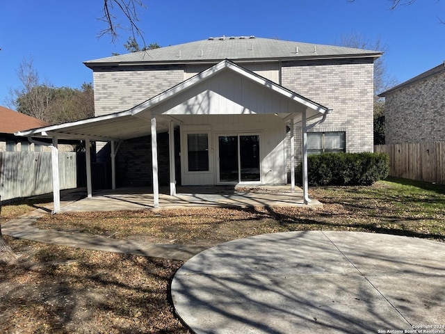 back of property featuring a patio area