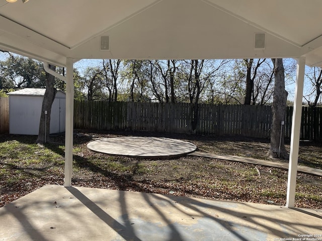 view of patio / terrace featuring a storage unit