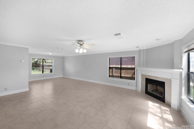 unfurnished living room featuring ceiling fan and ornamental molding