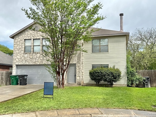 view of front facade with a garage and a front lawn