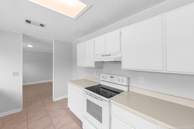 kitchen featuring premium range hood, white cabinets, electric range, a textured ceiling, and light tile patterned flooring