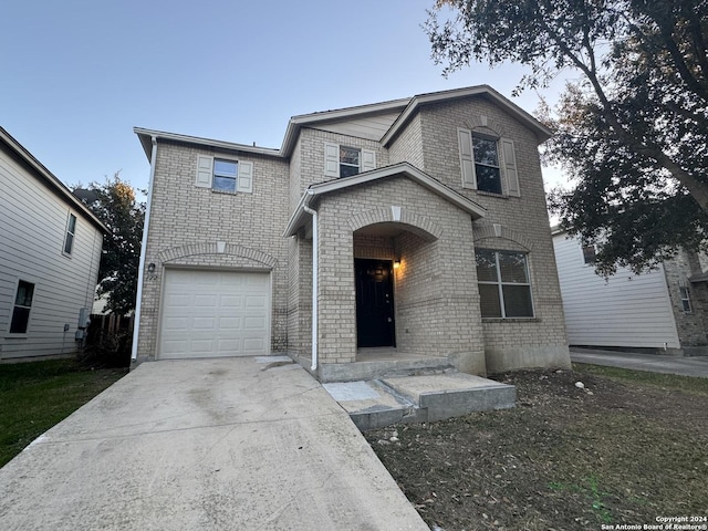 front facade with a garage