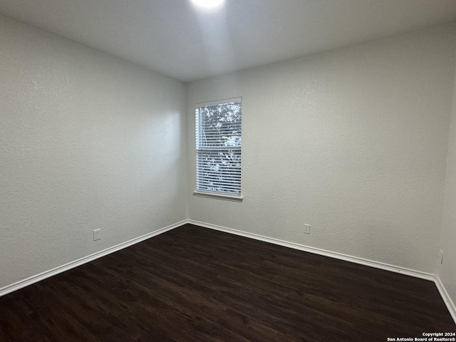 empty room featuring dark hardwood / wood-style floors