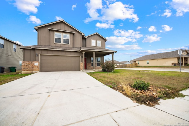 view of front of home featuring central AC, covered porch, a front yard, and a garage