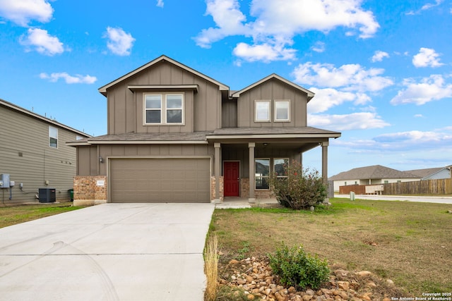 view of front of property with a porch, a front yard, central AC unit, and a garage