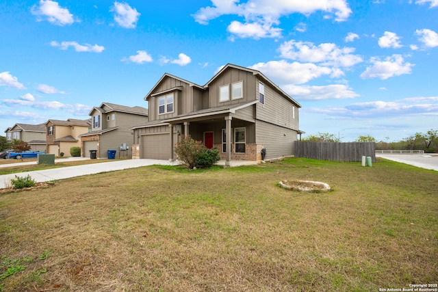 view of front of home featuring a front yard and a garage