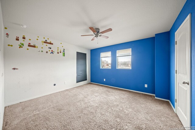 unfurnished bedroom featuring carpet flooring and ceiling fan