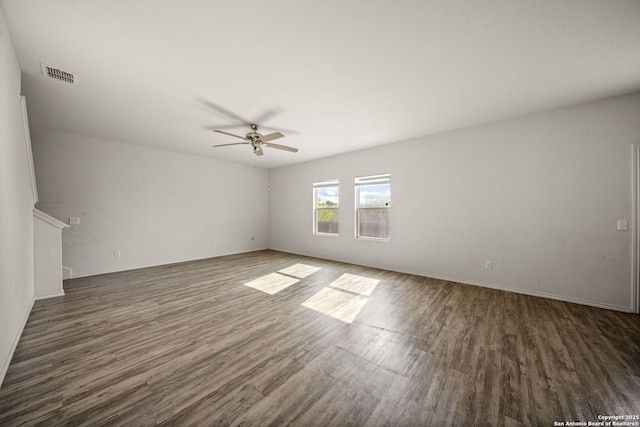 unfurnished room featuring ceiling fan and dark hardwood / wood-style flooring