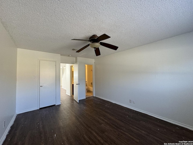 unfurnished bedroom featuring a textured ceiling, ceiling fan, and dark hardwood / wood-style floors