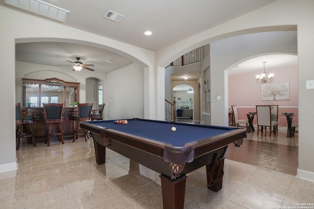 playroom with ceiling fan with notable chandelier and pool table