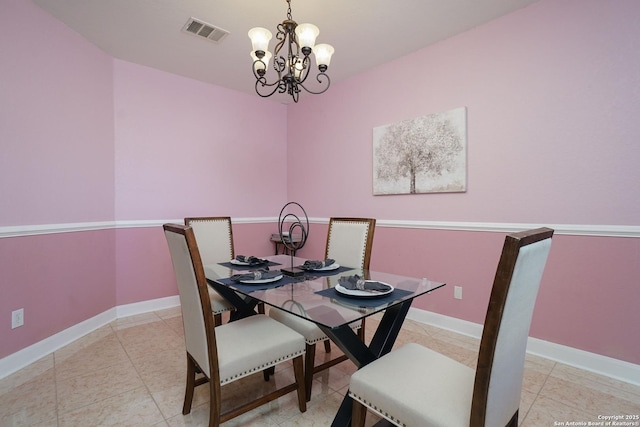 dining space with a chandelier