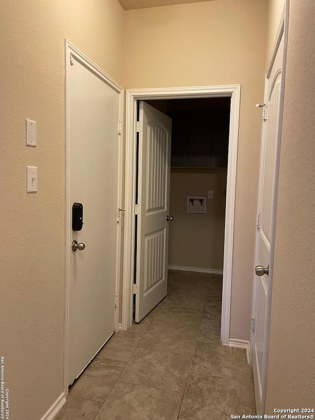 hallway featuring tile patterned floors