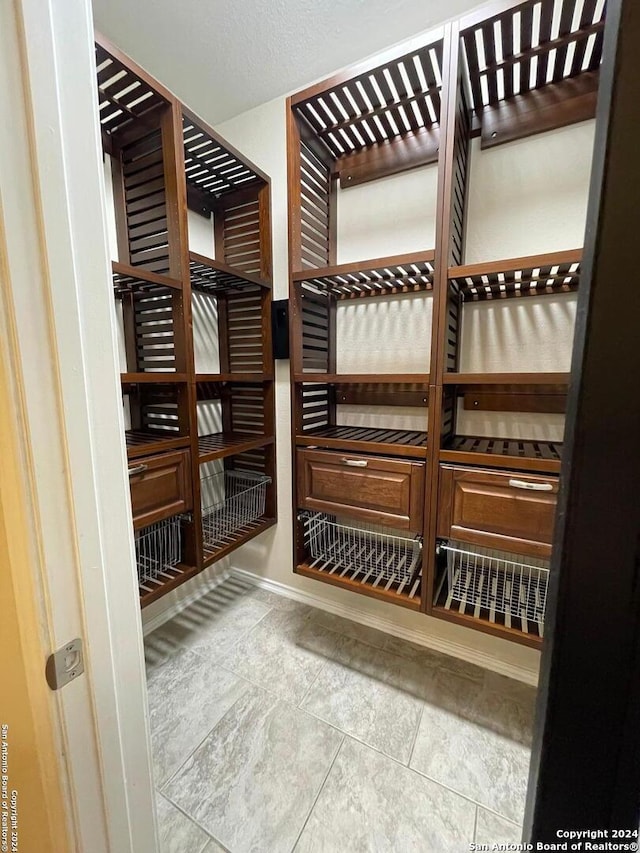 wine room featuring a textured ceiling