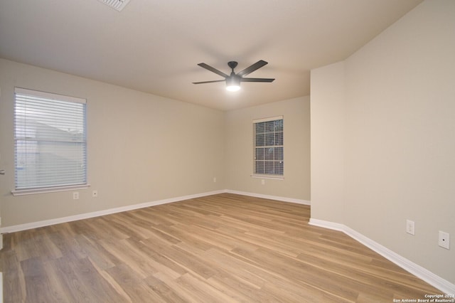 unfurnished room featuring ceiling fan and light hardwood / wood-style floors